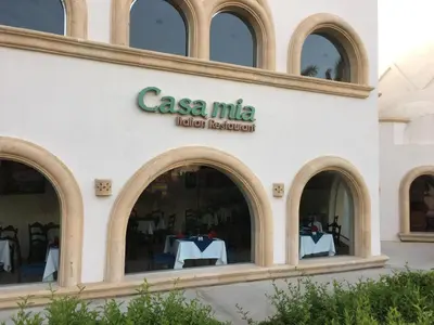 a building with a sign for a restaurant at Apartment in Stella di Mare Hurghada in Hurghada
