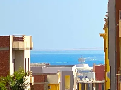 a view of the ocean from a building at Elephant House with Sea View in Hurghada