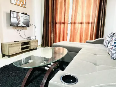 a living room with a couch and a glass table at Jazz House Hurghada canter with WI FI in Hurghada