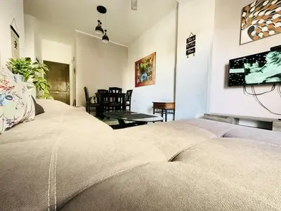 a bedroom with a bed and a tv on a wall at Jazz House Hurghada canter with WI FI in Hurghada