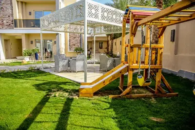 a playground in the yard of a house at Serenity Home Hurghada in Hurghada