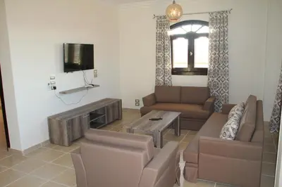 a living room with a couch and a tv at The View El Quseir in Quseir