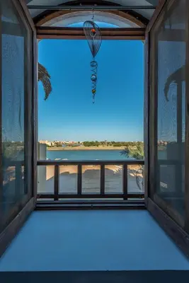 a window with a view of the ocean from a room at Lagoon view 1-bedroom apartment in West Golf El Gouna in Hurghada