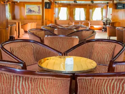 a dining car of a train with a table and chairs at GTS Nile Cruise Luxor Aswan every monday from Luxor friday from Aswan in Luxor