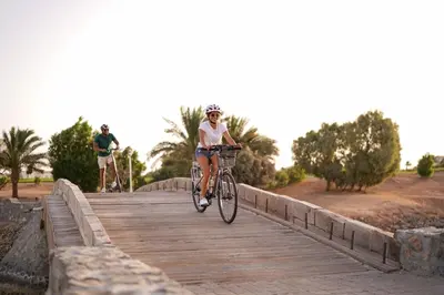 a person riding a bike on a bridge at Casa Cook El Gouna - Adults Only in Hurghada