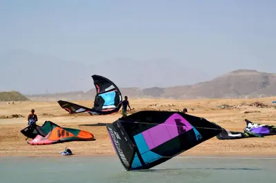 a group of people flying kites on a beach at Studio 5min from ElGouna and Kite station in Hurghada