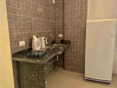 a bathroom with a sink and a phone on a counter at Nile Panorama Hotel & Restaurant in Luxor