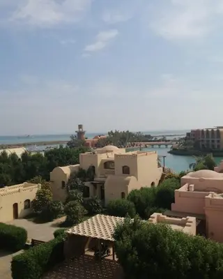 a view of a group of buildings and a body of water at EL Gouna Abu tig Studio- Economy stay in Hurghada