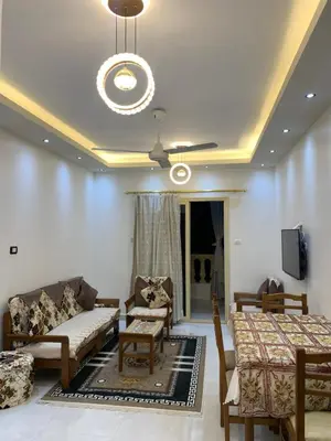 a living room with a couch and a table at Roma Apartment ( Center Of Hurghada, Sheraton Road ) in Hurghada