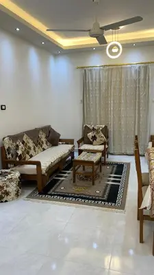 a living room with couches and chairs and a ceiling at Roma Apartment ( Center Of Hurghada, Sheraton Road ) in Hurghada