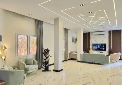 a large living room with couches and a television at Luxury Royal Blue Family Villa 8pers private pool in Hurghada