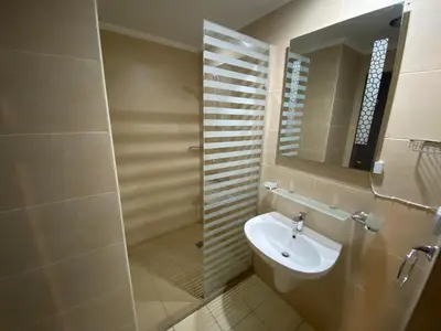 a bathroom with a sink and a mirror at Stylish Pool view studio in Al Dau Heights in Hurghada