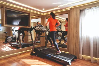 a woman running on a treadmill in a gym at JAZ Imperial Nile Imperial Cruise - Every Thursday from Luxor- Aswan- Luxor for 07 Nights in Luxor