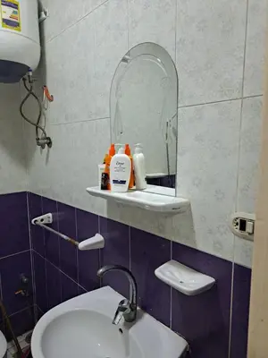 a bathroom with a sink and a mirror at Sweet Home- ممنوع للمصريين Open 24 Hour in Hurghada