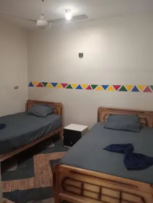 a bedroom with two beds at Elephantina sobek guest house in Aswan