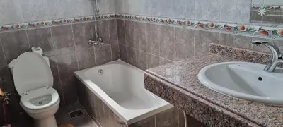 a bathroom with a sink and a toilet and a sink at DREAM ISLAND Hotel in Luxor