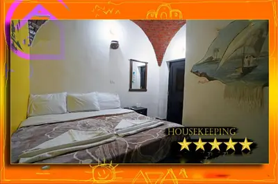 a bedroom with a bed with stars on it at Opal privat nubian hotel in Aswan