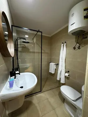 a bathroom with a sink and a toilet and a shower at Luxury Hurghada Self-Catering Apartments & Studios, Al Dau Heights in Hurghada