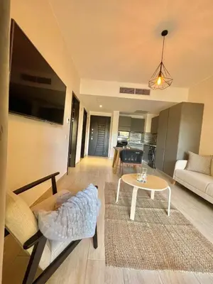 a living room with a couch and a table at Luxury Hurghada Self-Catering Apartments & Studios, Al Dau Heights in Hurghada