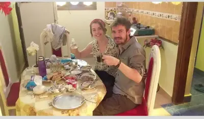 a man and a woman sitting at a table at Roma Guest house in Aswan