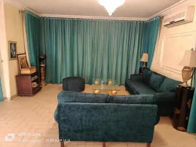 a living room with a couch and a table at Villa with Private Pool in Hurghada