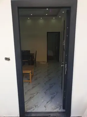an open door to a room with a marble floor at Bravey Apartments in Hurghada