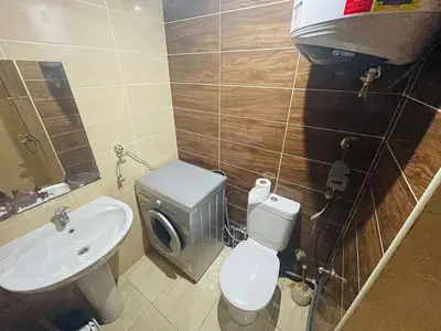 a bathroom with a toilet and a sink at Studio Florenza Khamsin in Hurghada