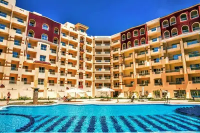 a large apartment building with a large swimming pool at Apartment I in Florenza Khamsin in Hurghada