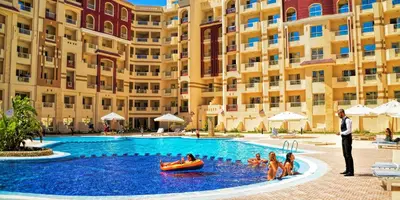 a group of people in a pool at a hotel at Studio H in Florenza Khamsin in Hurghada