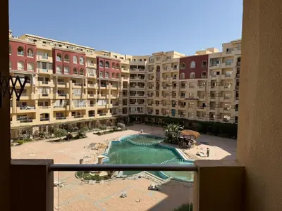 a view from a balcony of a large apartment building at Studio H in Florenza Khamsin in Hurghada
