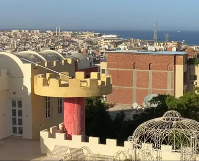 a view of a city with a building at Bahga Palace 5 Residential Apartments in Hurghada