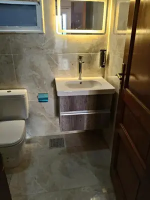 a bathroom with a sink and a toilet at Studio Lotus compound near Touristic Mamsha in Hurghada