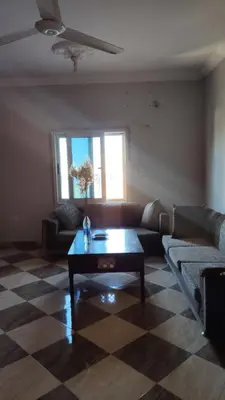 a living room with a couch and a coffee table at IKEA Flats in Hurghada