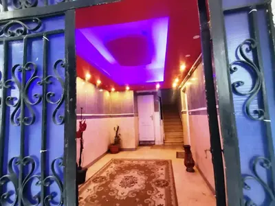 a hallway with a blue gate with a purple ceiling at Mama Africa in Hurghada