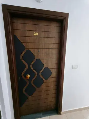 a wooden door with a number on it at Rhein in Hurghada