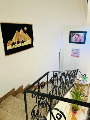 a picture of the pyramids on a wall at Tara Apartments in Luxor
