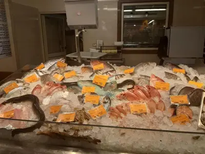 a bunch of different types of fish on a table at apartman Marek in Hurghada