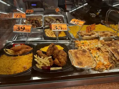 a buffet line with different types of food on display at apartman Marek in Hurghada
