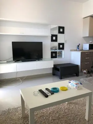 a living room with a tv and a coffee table at G cribs B1F2 in Hurghada