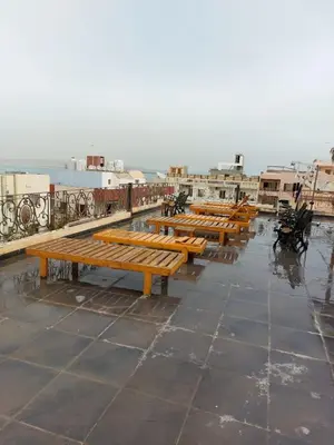 a row of wooden benches sitting on top of a roof at The LOTUS in Hurghada