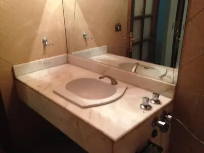 a bathroom with a sink and a mirror at The LOTUS in Hurghada