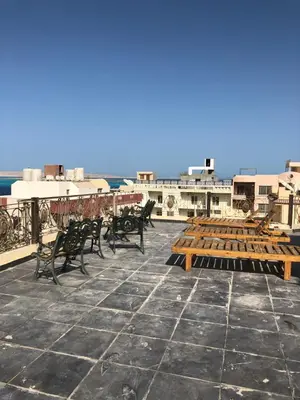 a group of benches sitting on top of a roof at The LOTUS in Hurghada