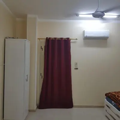 a room with a red curtain in a room at Sweet Home 5 Open 24 Hour in Hurghada