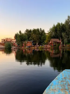 a view of a body of water with trees and buildings at Luxor Old Nile Hotel in Luxor