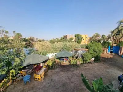 an overhead view of an outdoor market with umbrellas at Luxor Old Nile Hotel in Luxor