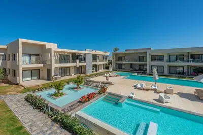 an image of a villa with a swimming pool at Cozy Studio in G-Cribs with pool - Golden Apartments El Gouna in Hurghada