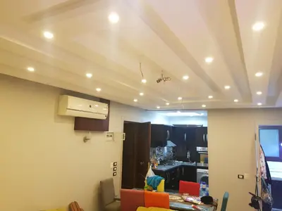 a kitchen with a ceiling with lights on it at Chalet stella makadi family only in Hurghada