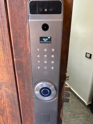 a remote control is attached to a wooden door at Chalet stella makadi family only in Hurghada