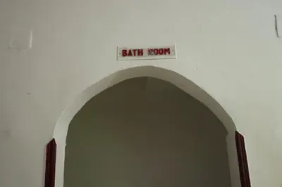 an archway with a sign that reads bath room at SWEET HOSTEL LUXOR in Luxor