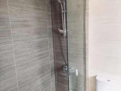 a shower with a glass door in a bathroom at Renovated Lovely Cozy Studio in G Cribs, Elgouna in Hurghada